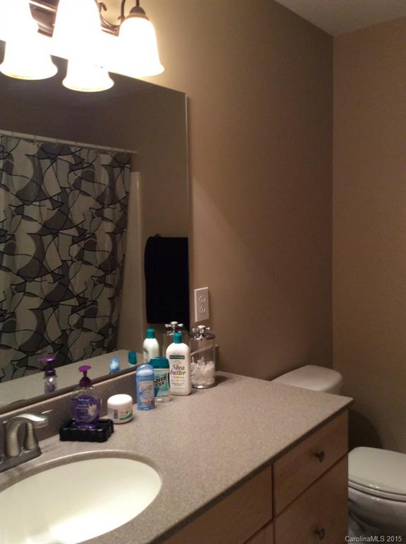 345 Gold Knob Road Salisbury, NC 28146 - Photo 11 of 15 a bathroom with a sink and a mirror
