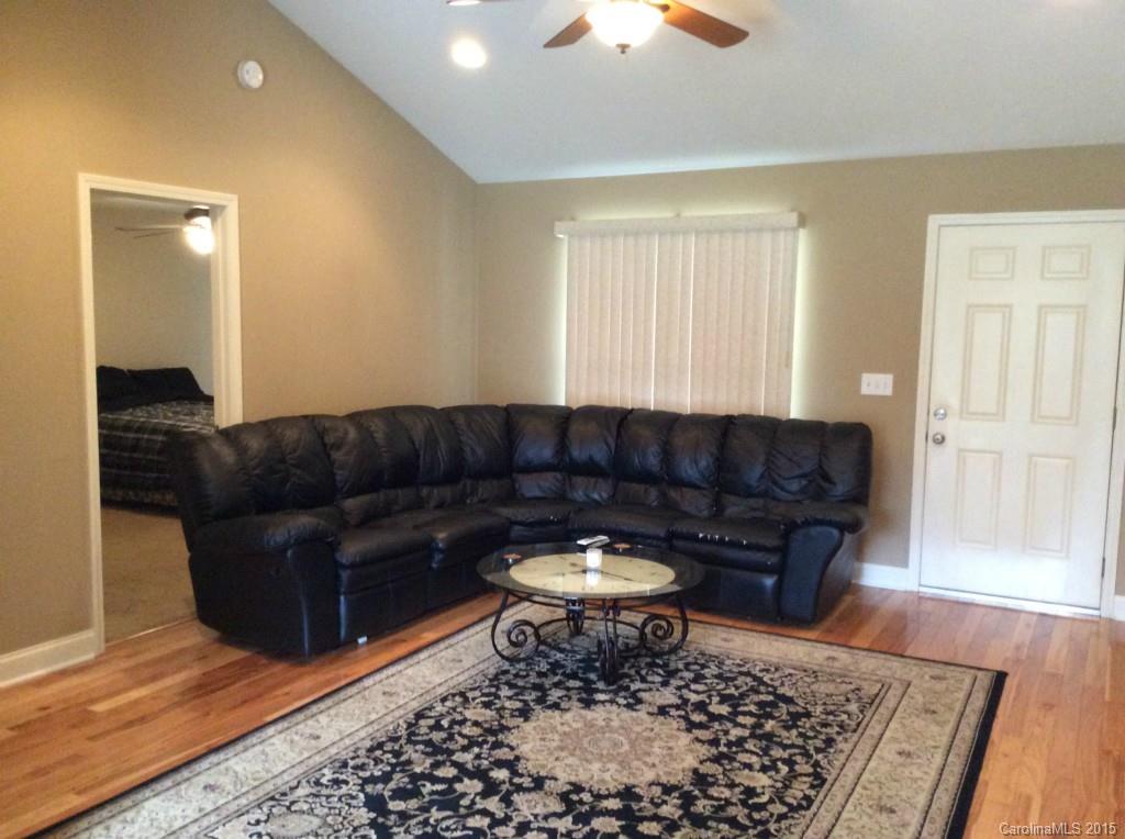 345 Gold Knob Road Salisbury, NC 28146 - Photo 5 of 15 a living room with a couch and a rug