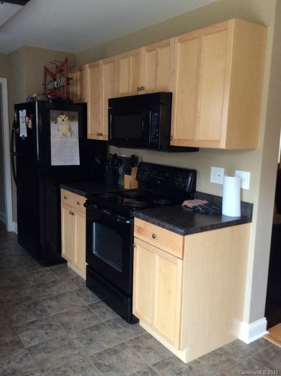 345 Gold Knob Road Salisbury, NC 28146 - Photo 6 of 15 a kitchen with stainless steel appliances granite countertop a stove a microwave and a refrigerator