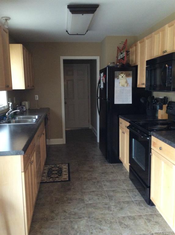 345 Gold Knob Road Salisbury, NC 28146 - Photo 7 of 15 a kitchen with a sink stove and refrigerator