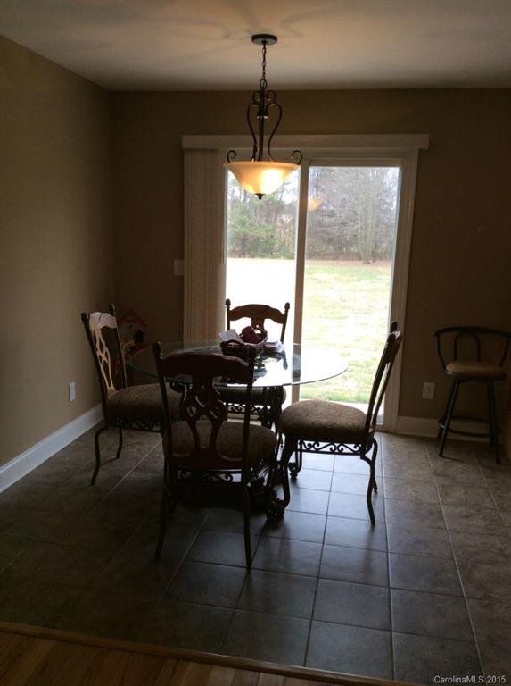 345 Gold Knob Road Salisbury, NC 28146 - Photo 9 of 15 a view of a dining room with furniture and window
