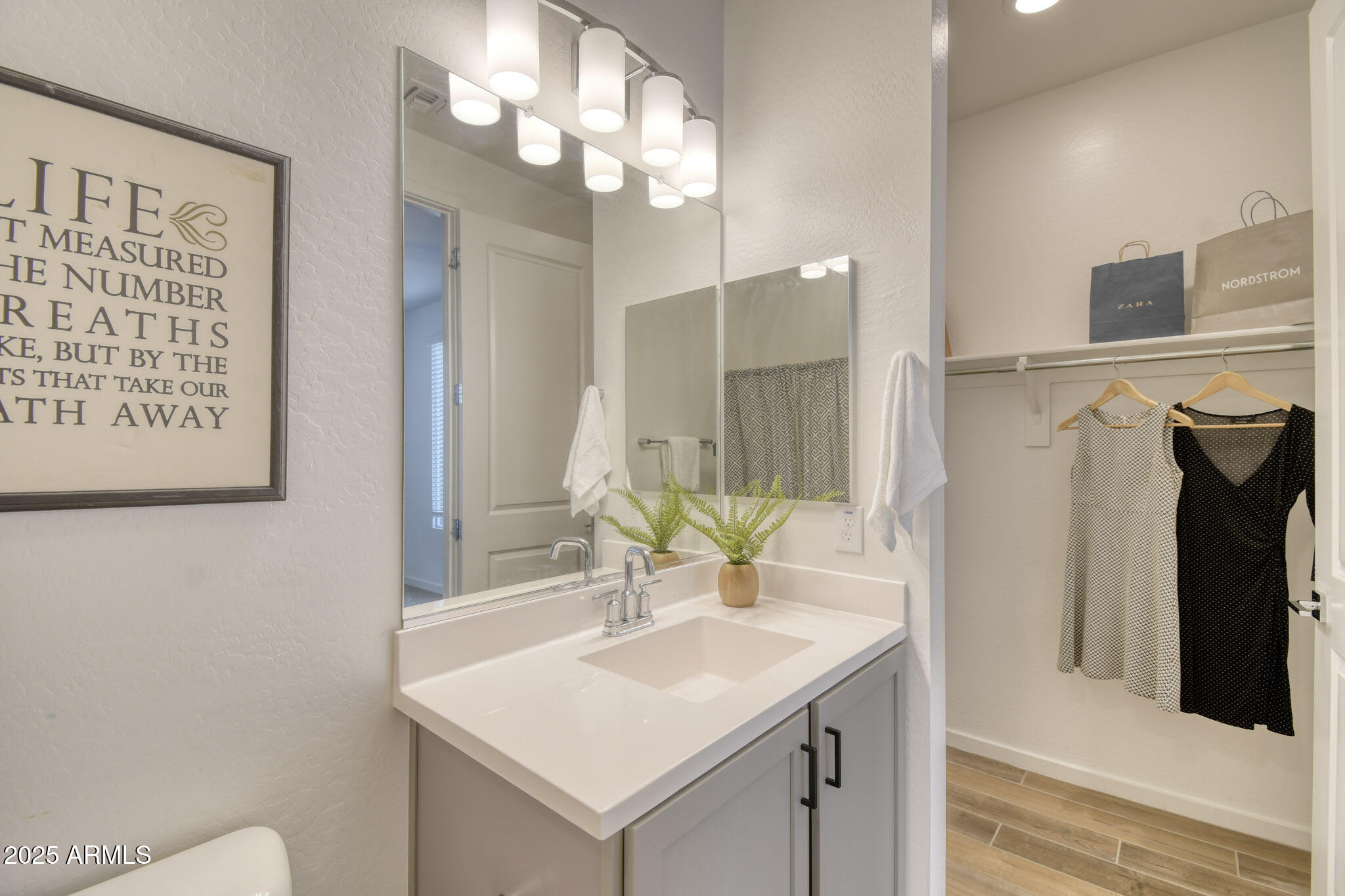 901 South Smith Road, Unit 1065 Tempe, AZ 85281 - Photo 11 of 26 a bathroom with a sink vanity and a mirror