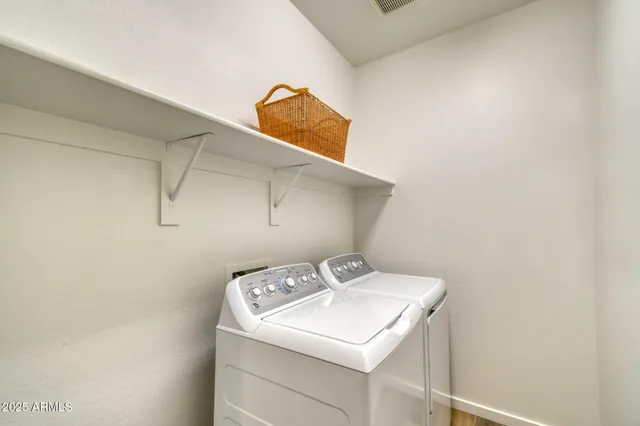 a utility room with dryer and washer