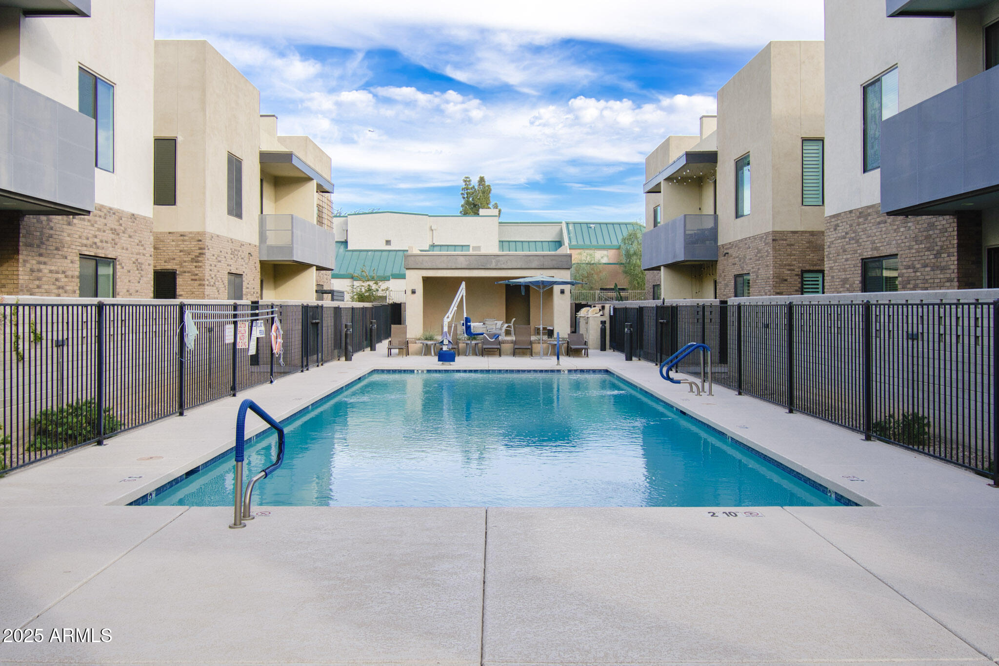 901 South Smith Road, Unit 1065 Tempe, AZ 85281 - Photo 17 of 26 a view of a patio with swimming pool