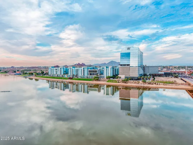 a view of swimming pool with outdoor seating and barbeque in the back