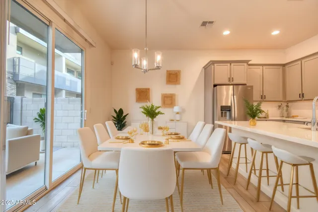 a view of a dining room with furniture window and outside view