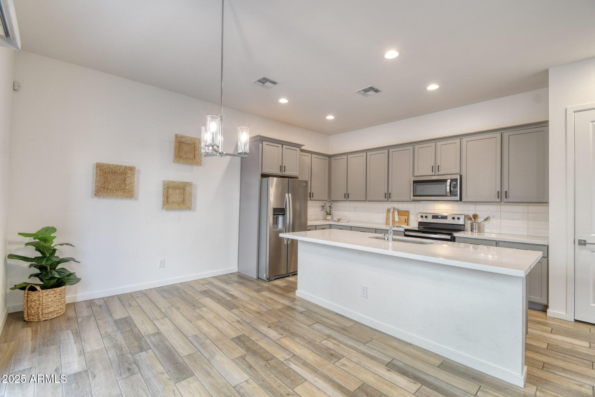 901 South Smith Road, Unit 1065 Tempe, AZ 85281 - Photo 5 of 26 a kitchen with stainless steel appliances a refrigerator sink and microwave