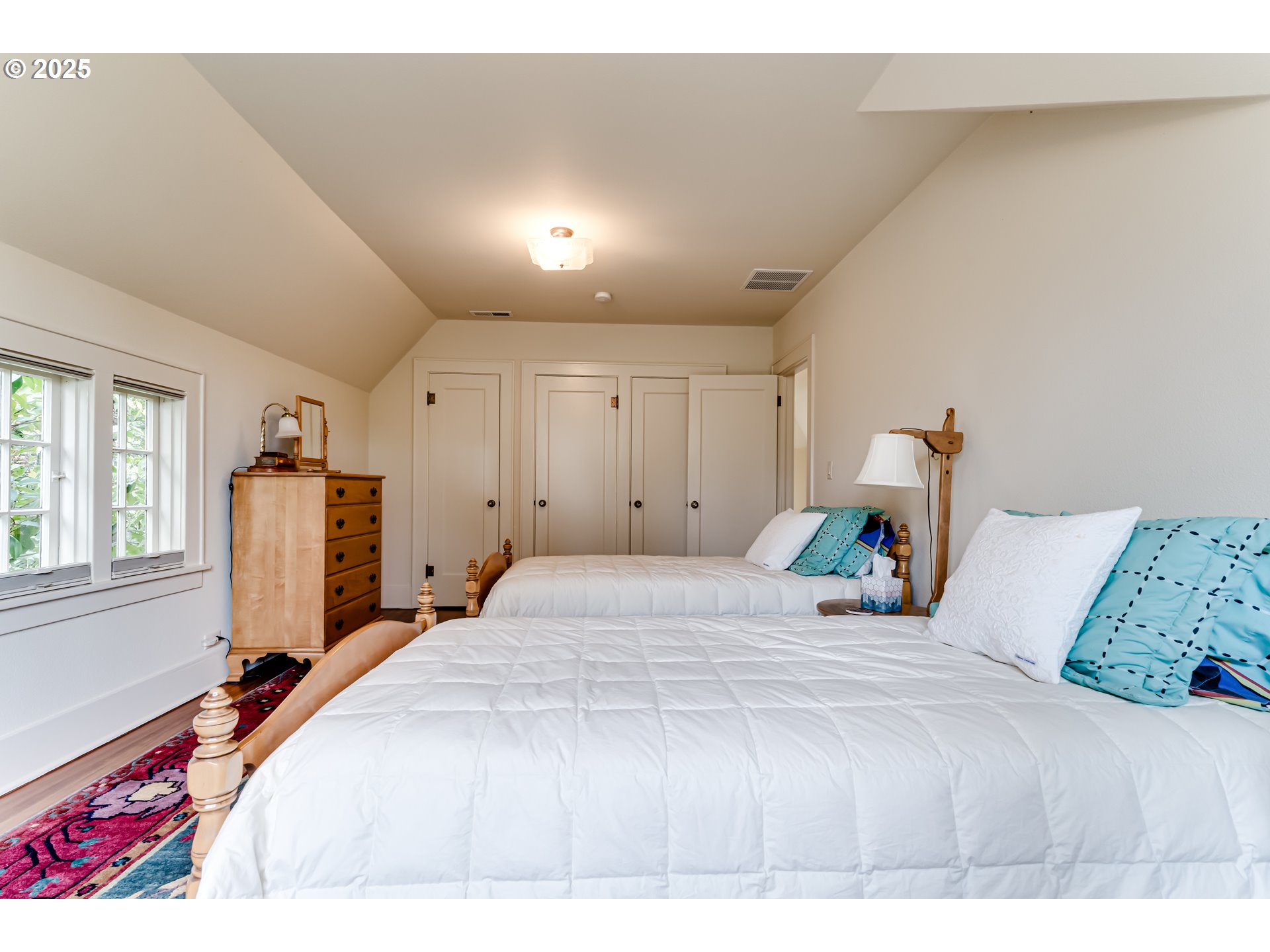 1976 University Street Eugene, OR 97403 - Photo 17 of 36 a bedroom with a bed and a large window