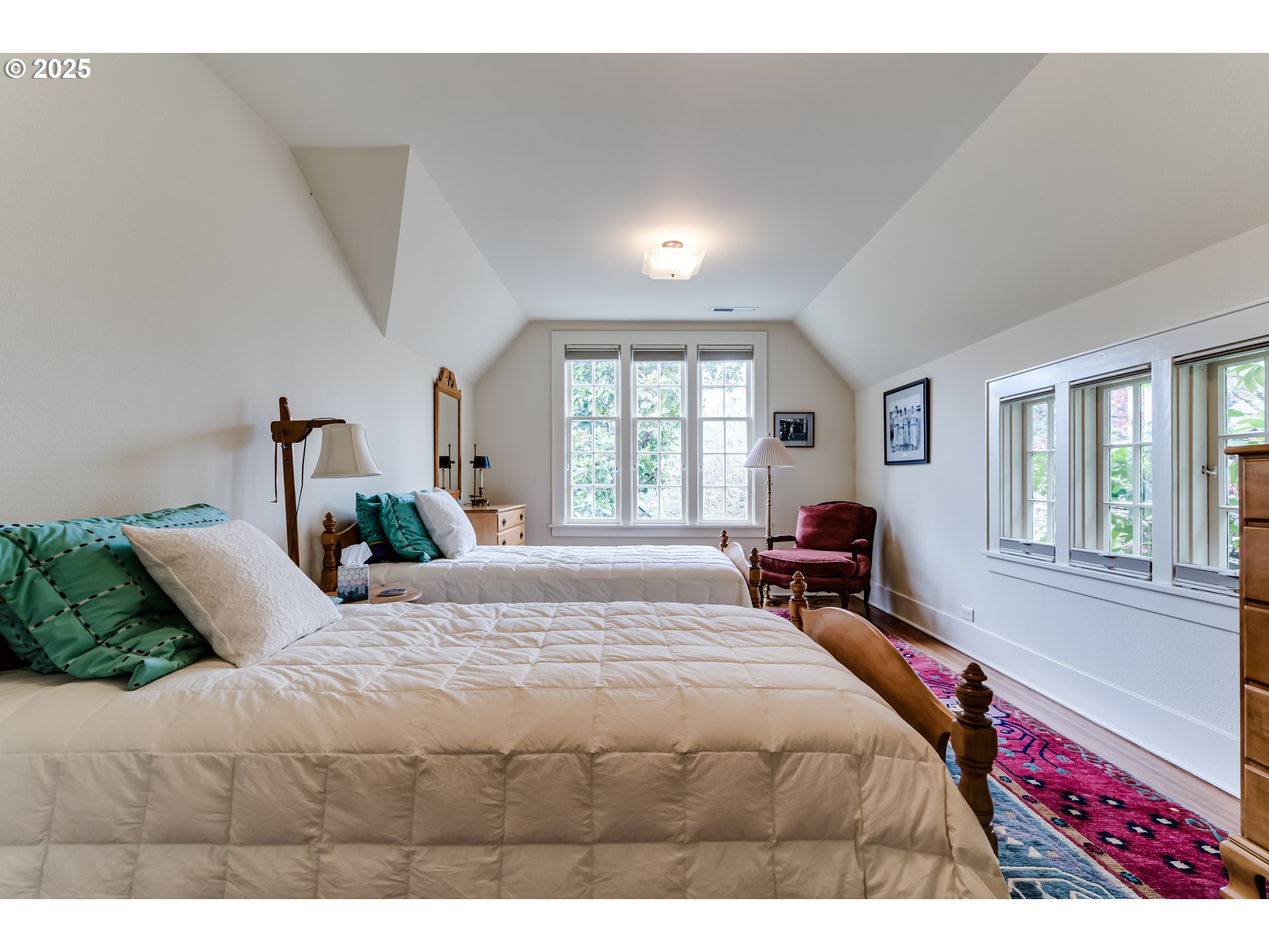 1976 University Street Eugene, OR 97403 - Photo 18 of 36 a bedroom with a large bed and a large window