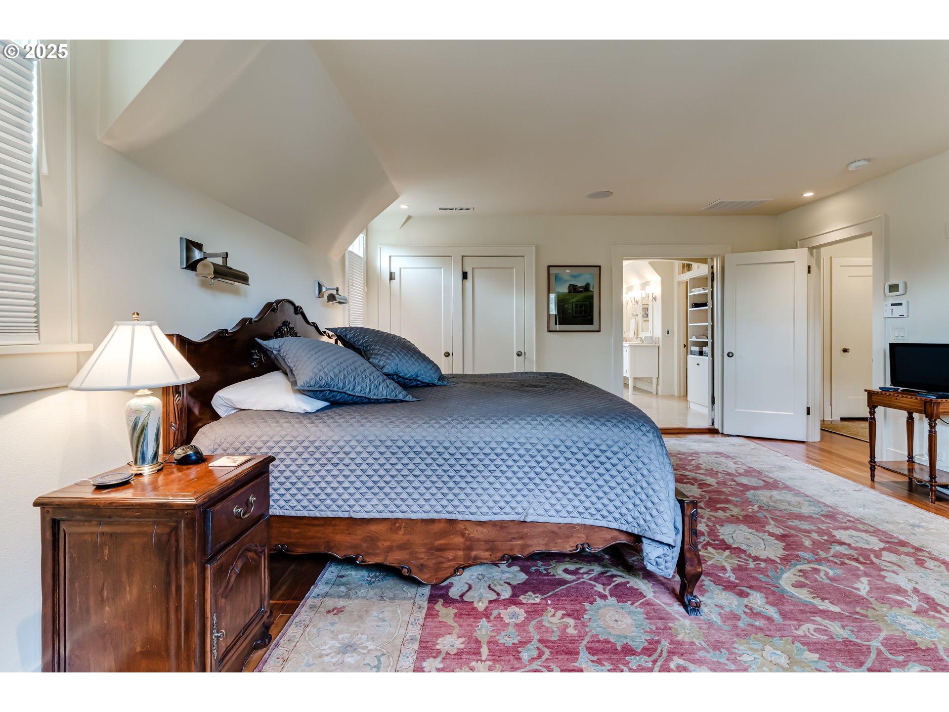 1976 University Street Eugene, OR 97403 - Photo 20 of 36 a bedroom with a bed and wooden floor