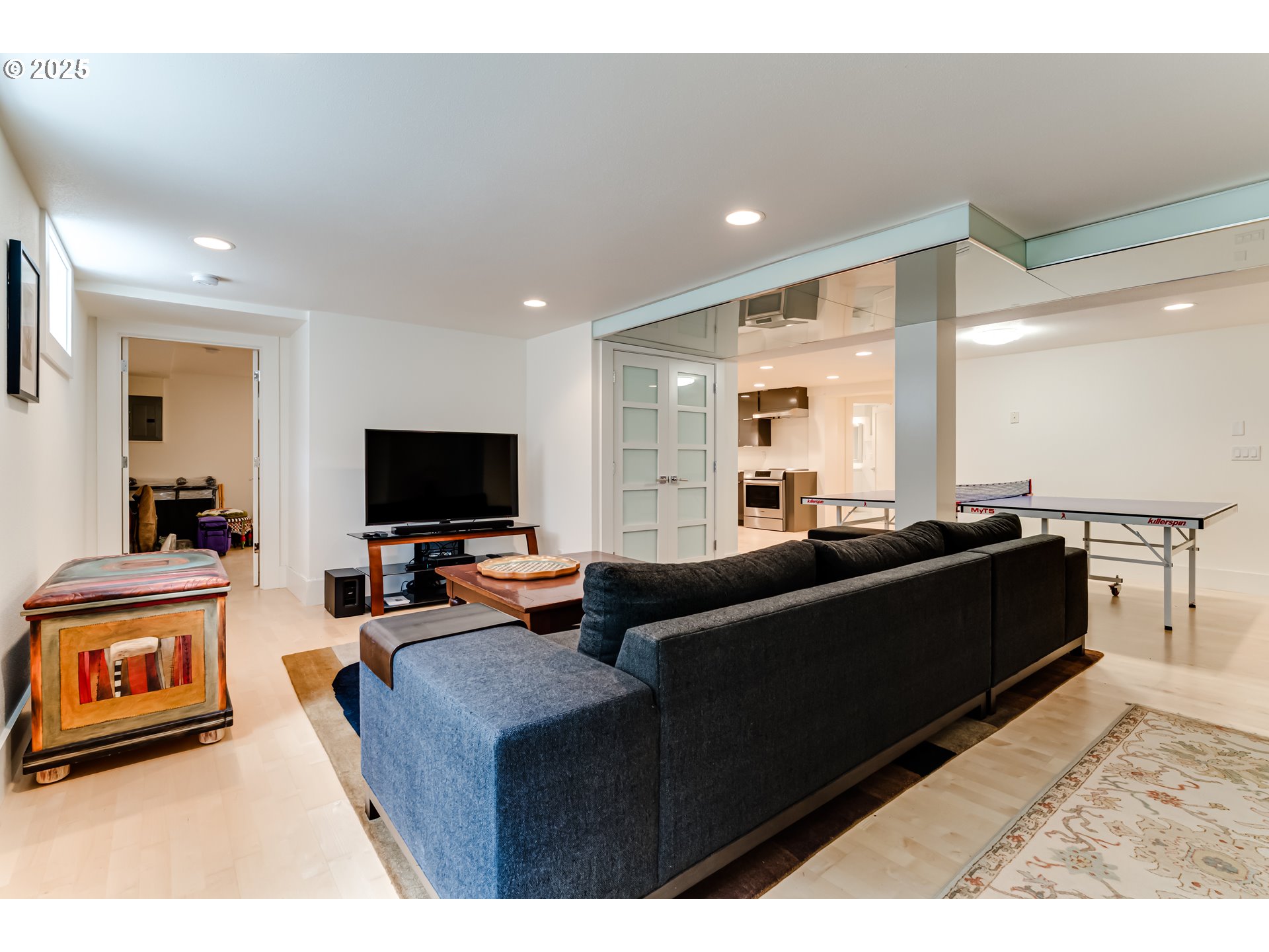 1976 University Street Eugene, OR 97403 - Photo 24 of 36 a living room with furniture and a flat screen tv