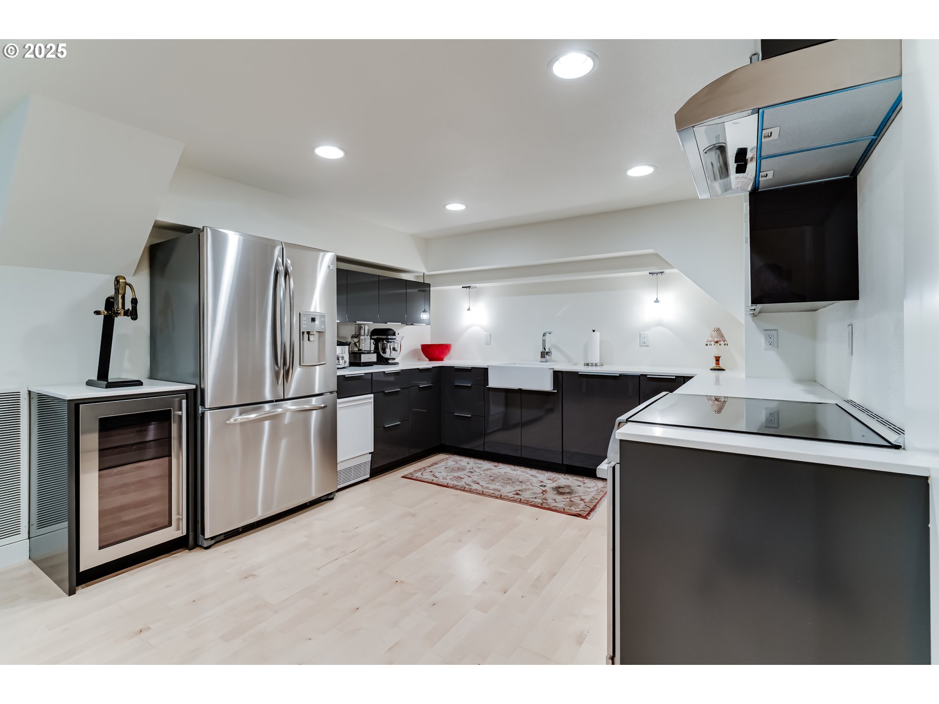 1976 University Street Eugene, OR 97403 - Photo 26 of 36 a kitchen with stainless steel appliances kitchen island a refrigerator sink and microwave