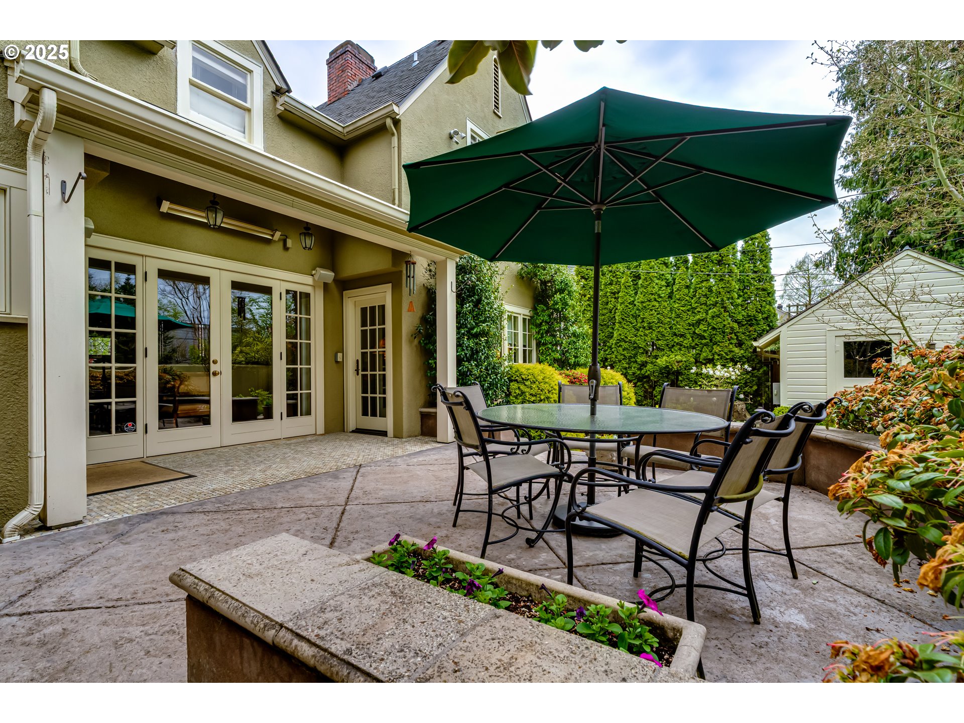 1976 University Street Eugene, OR 97403 - Photo 29 of 36 an outdoor space with furniture and umbrella