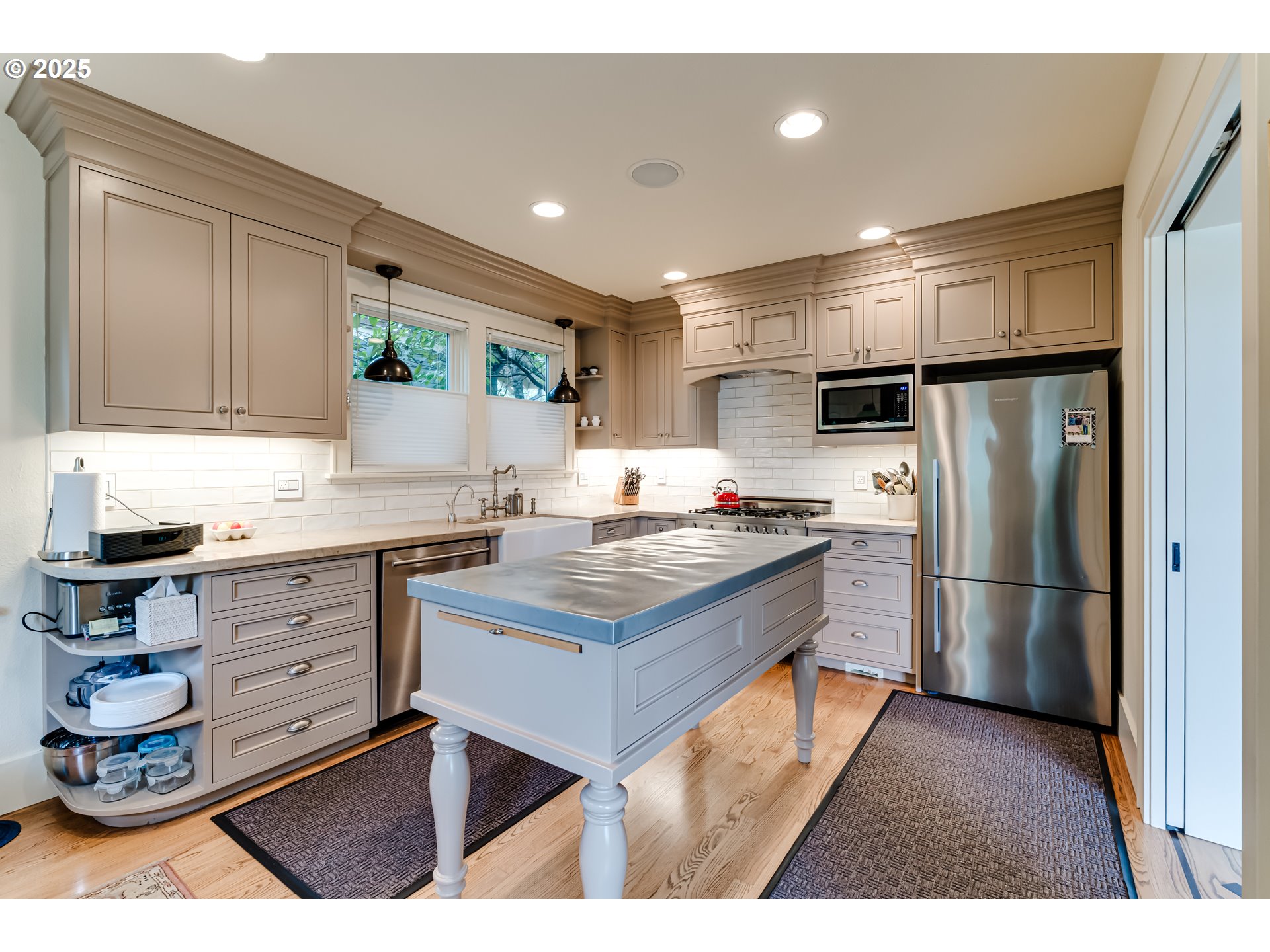 1976 University Street Eugene, OR 97403 - Photo 10 of 36 a kitchen with a refrigerator sink and cabinets