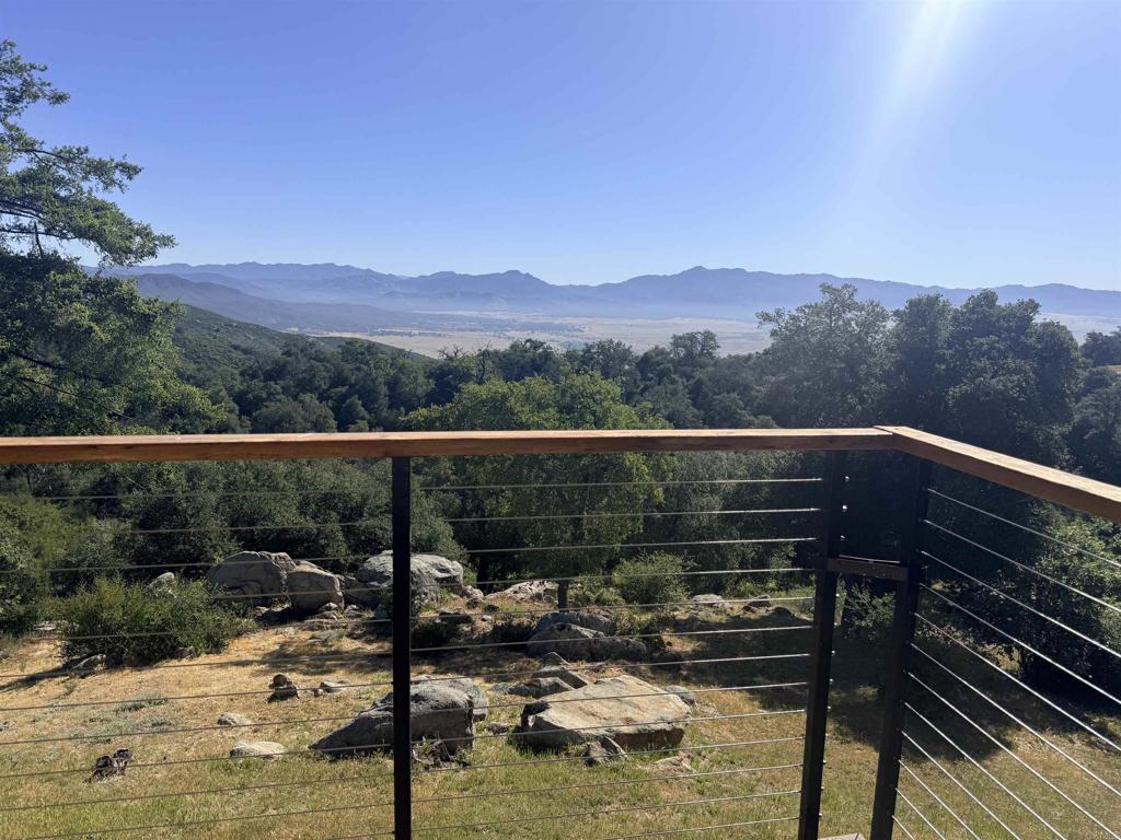 a view of a balcony with a bench