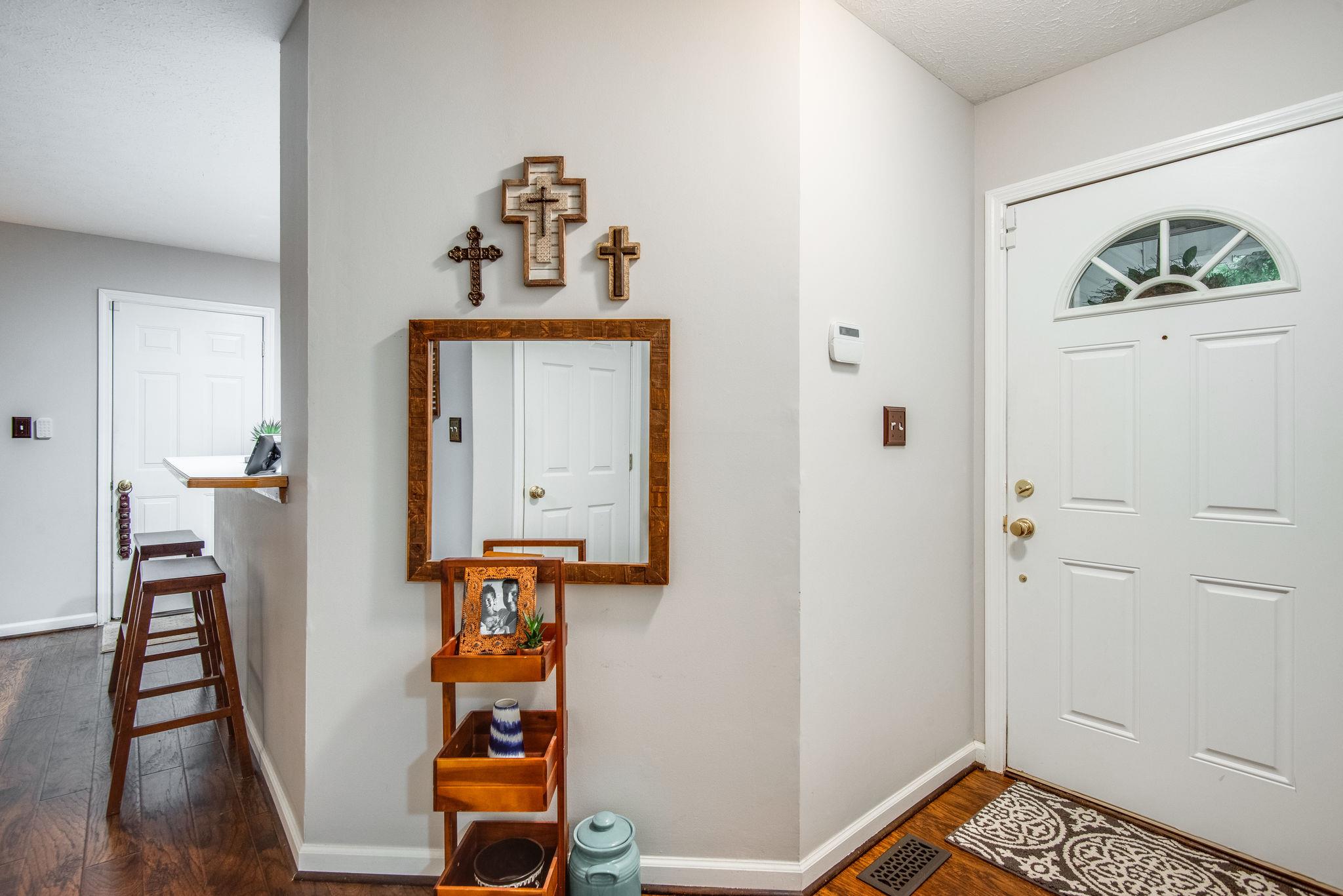 1020 Anderson Road Dickson, TN 37055 - Photo 7 of 28 a view of hallway with wooden floor and stairs
