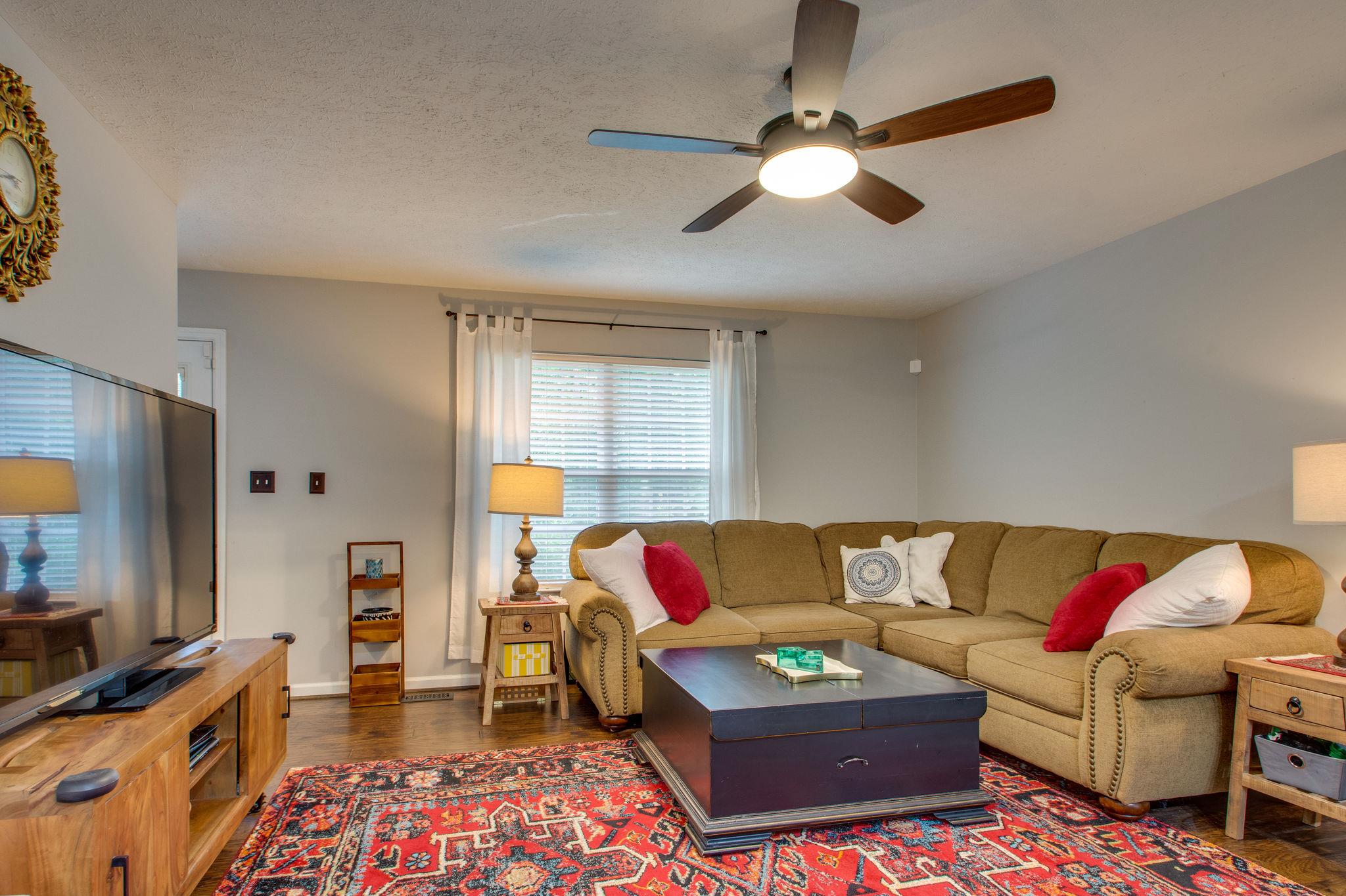 1020 Anderson Road Dickson, TN 37055 - Photo 8 of 28 a living room with furniture and a flat screen tv