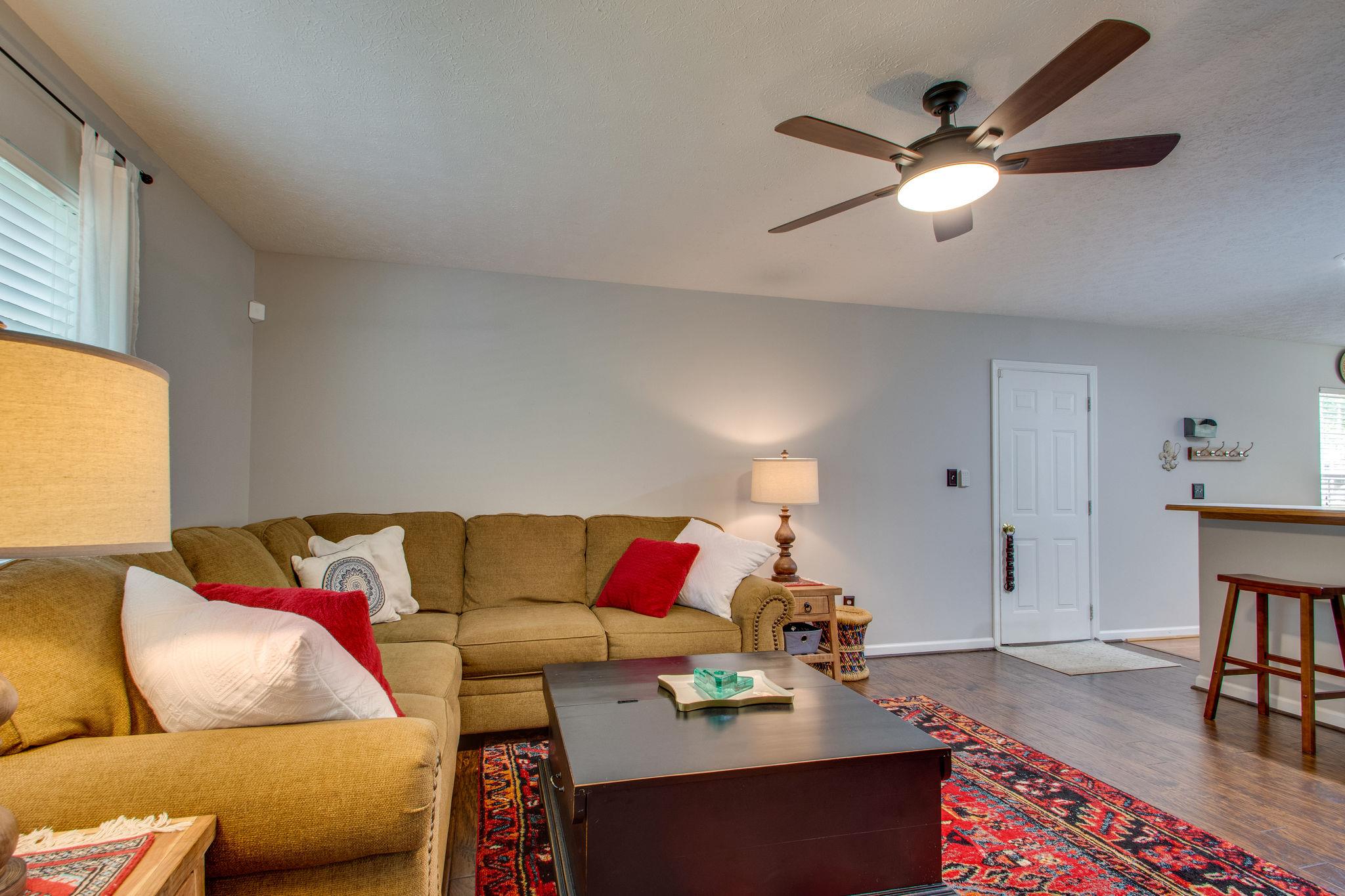 1020 Anderson Road Dickson, TN 37055 - Photo 9 of 28 a living room with furniture and wooden floor