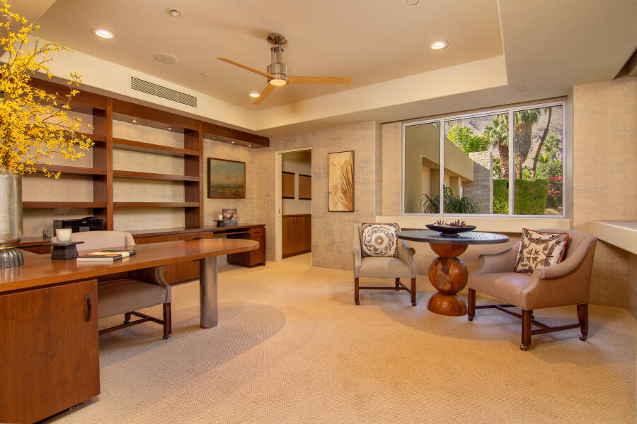 630 North Cahuilla Road Palm Springs, CA 92262 - Photo 11 of 65 a living room with furniture a window and a table