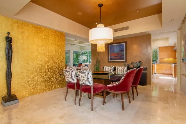 a room with furniture and a potted plant