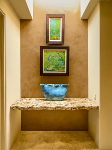 a view of a dining room with furniture and a kitchen