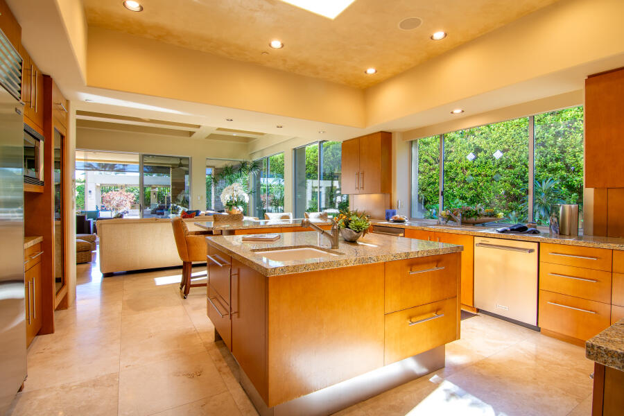 630 North Cahuilla Road Palm Springs, CA 92262 - Photo 17 of 65 a view of a kitchen with kitchen island a sink and a large window