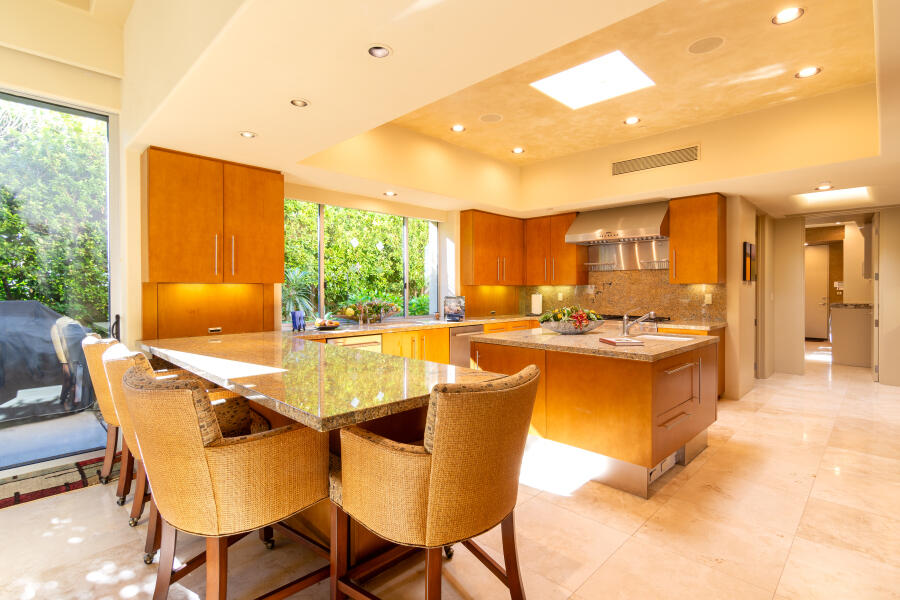 630 North Cahuilla Road Palm Springs, CA 92262 - Photo 19 of 65 a view of a dining room with furniture and a kitchen