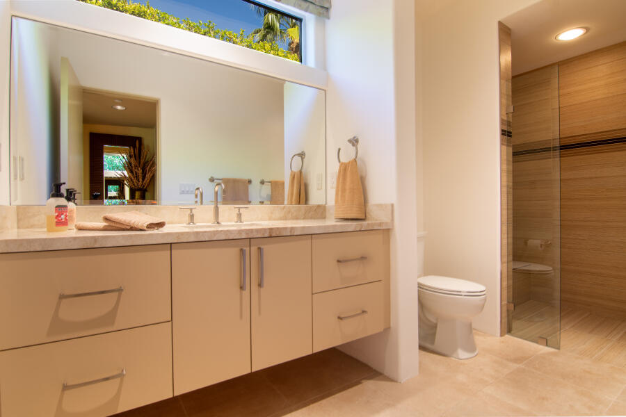 630 North Cahuilla Road Palm Springs, CA 92262 - Photo 43 of 65 a bathroom with a double vanity sink and a mirror