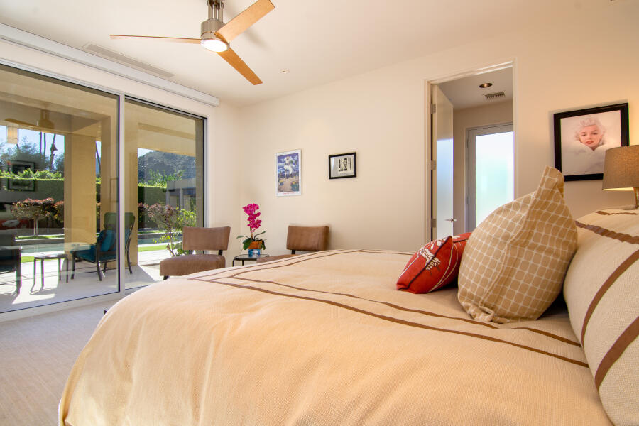 630 North Cahuilla Road Palm Springs, CA 92262 - Photo 49 of 65 a bedroom with a bed and a large window