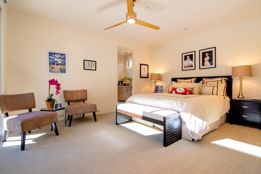 630 North Cahuilla Road Palm Springs, CA 92262 - Photo 50 of 65 a spacious bedroom with a bed and a couch