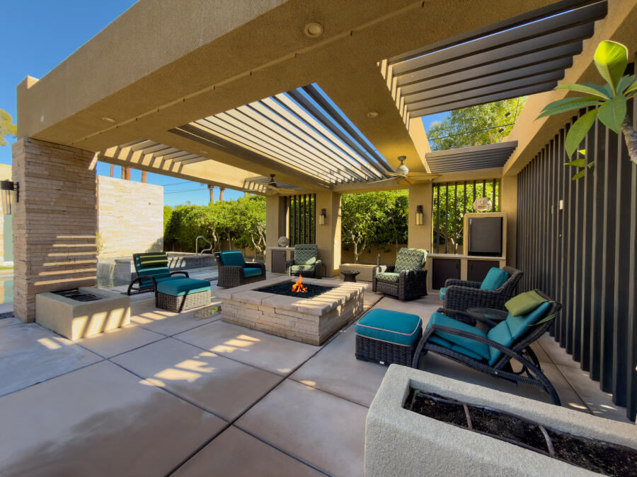630 North Cahuilla Road Palm Springs, CA 92262 - Photo 55 of 65 a view of a patio with table and chairs and potted plants