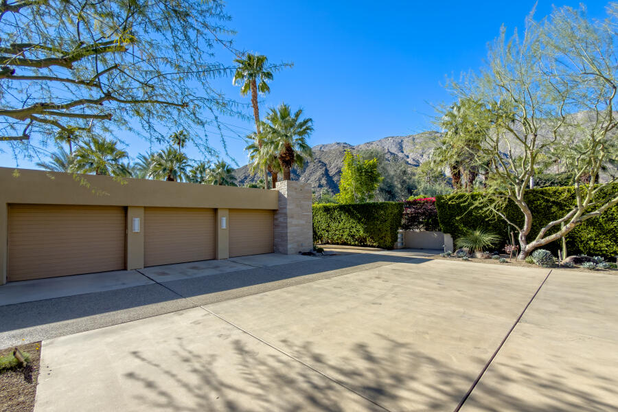 630 North Cahuilla Road Palm Springs, CA 92262 - Photo 65 of 65 a view of backyard with potted plants and a large tree