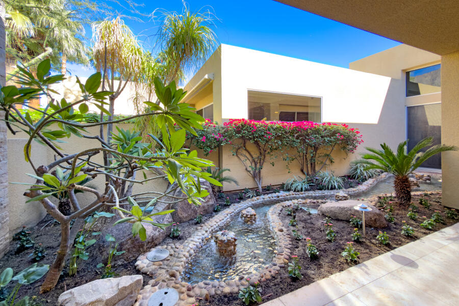 630 North Cahuilla Road Palm Springs, CA 92262 - Photo 10 of 65 a potted plant sitting in front of a house
