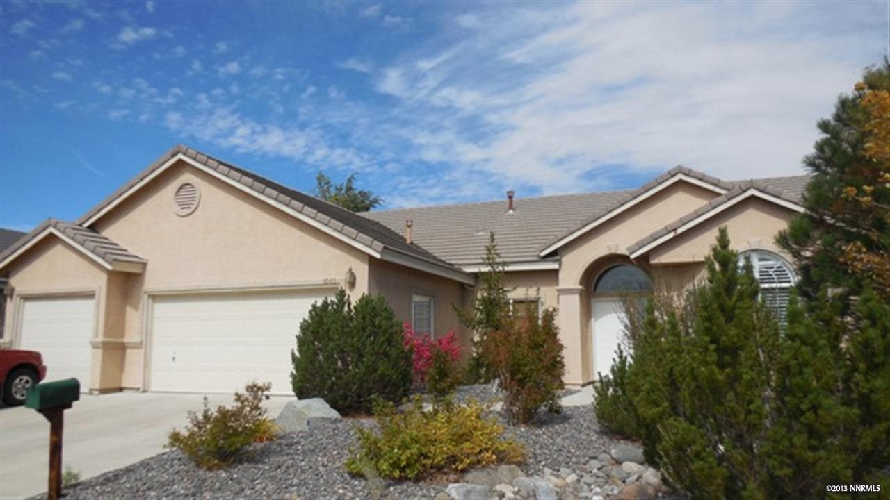 1045 University Ridge Drive Reno, NV 89512 - Photo 1 of 1 a view of a house with a yard