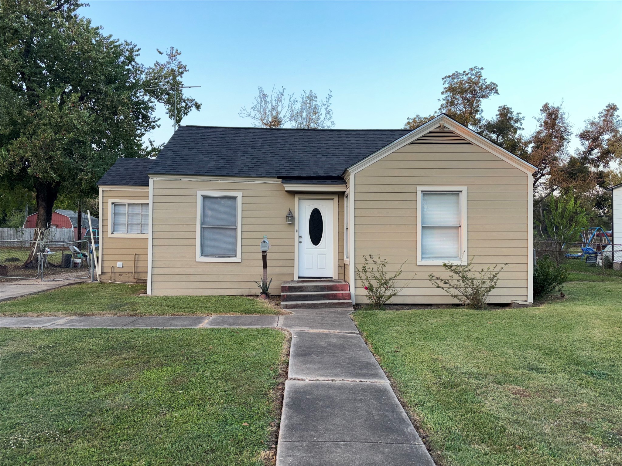 10523 Oswego Street Houston, TX 77029 - Photo 1 of 11 a front view of a house with a yard