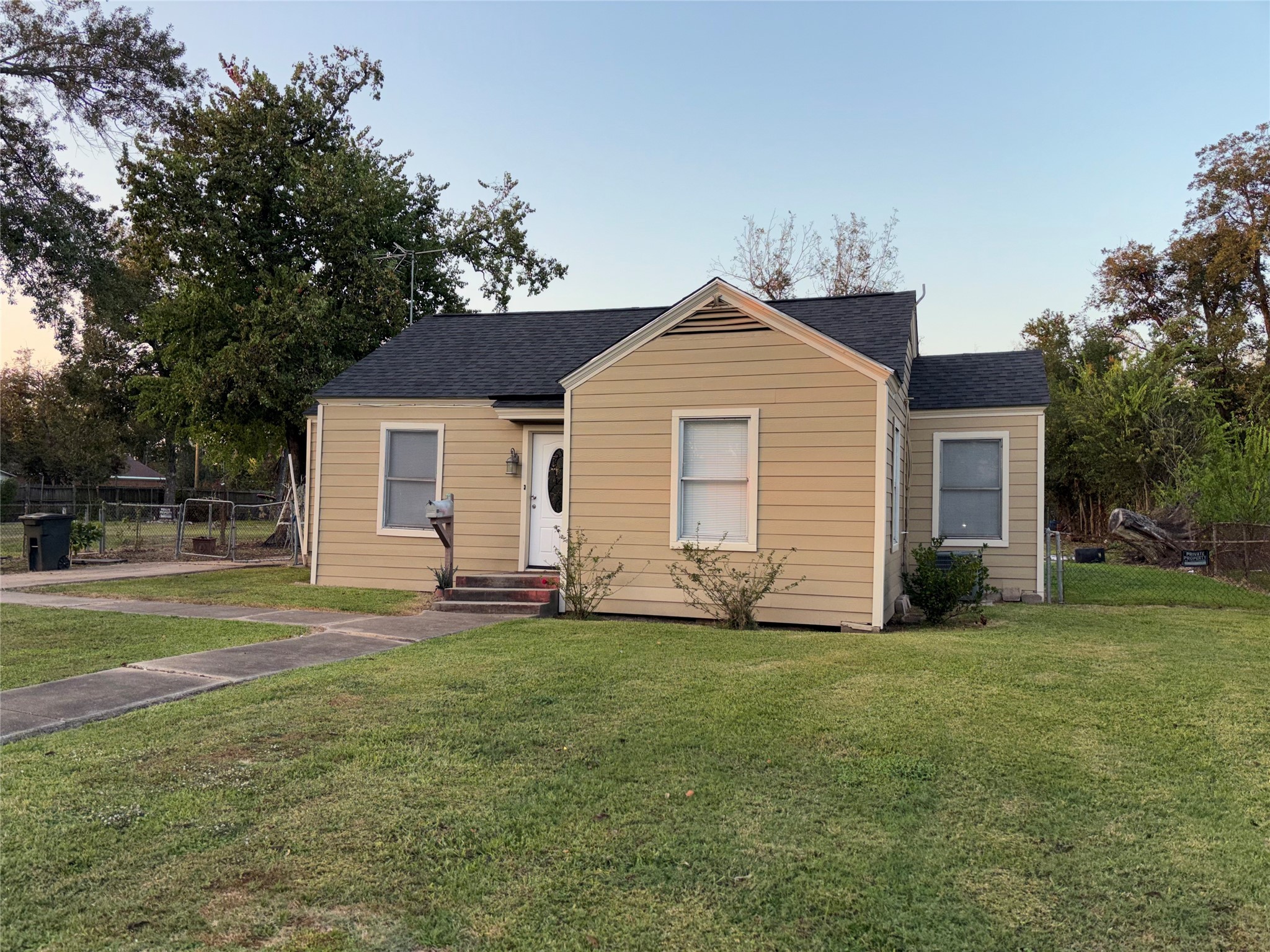 10523 Oswego Street Houston, TX 77029 - Photo 3 of 11 a front view of a house with a garden
