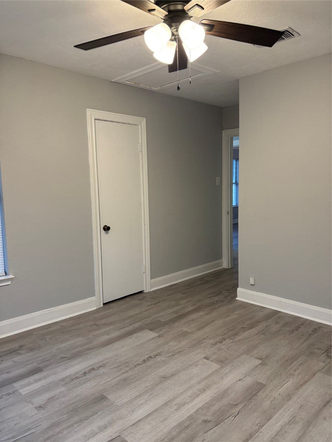 10523 Oswego Street Houston, TX 77029 - Photo 5 of 11 a view of an empty room with wooden floor