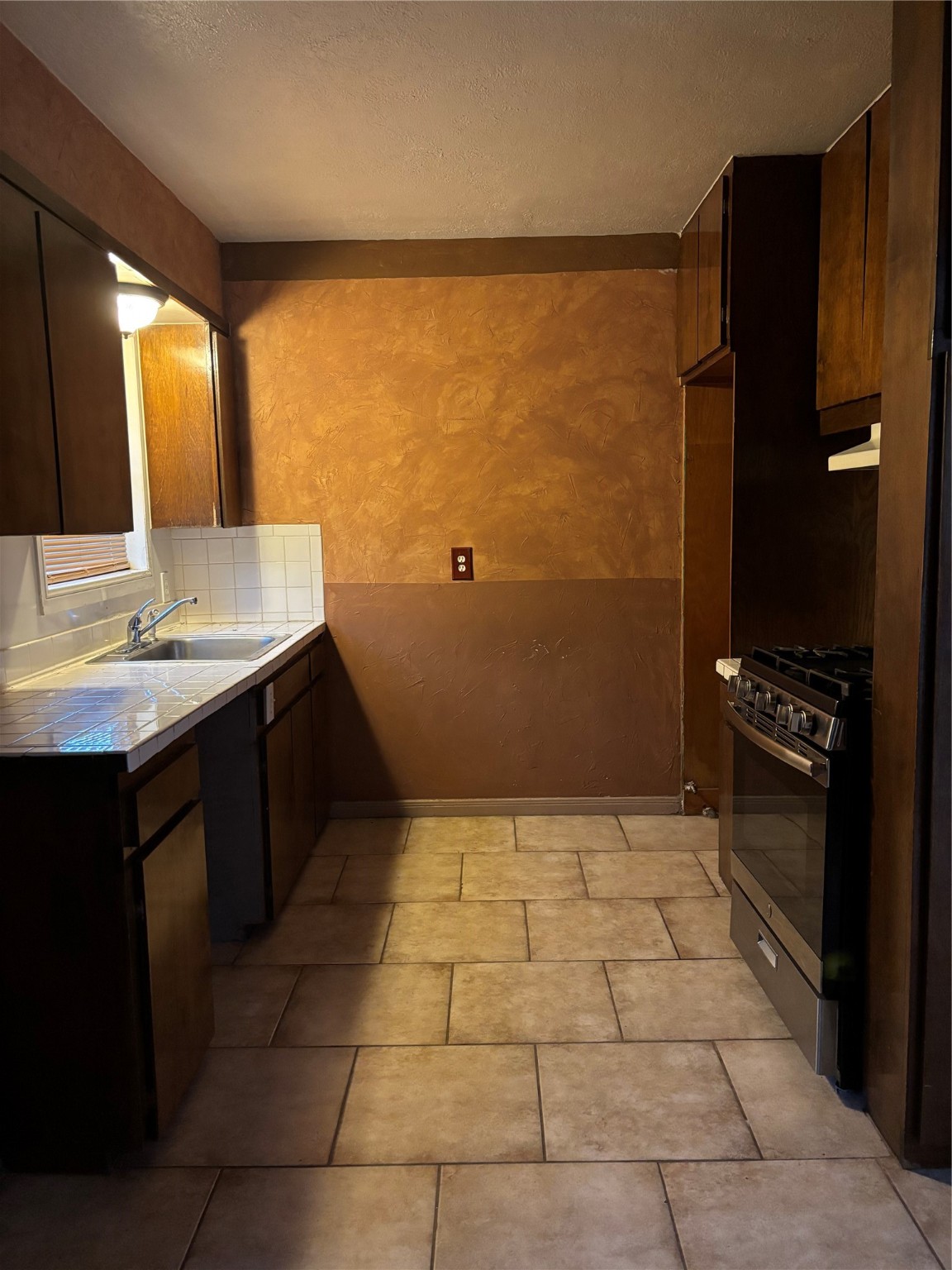 10523 Oswego Street Houston, TX 77029 - Photo 8 of 11 a bathroom with a sink a toilet and a mirror