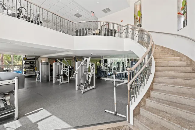 a view of a livingroom with furniture and staircase