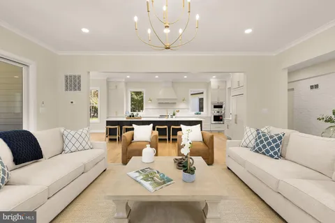 a view of dining room and kitchen table with chairs