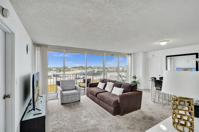a kitchen with stainless steel appliances granite countertop a sink a stove and cabinets