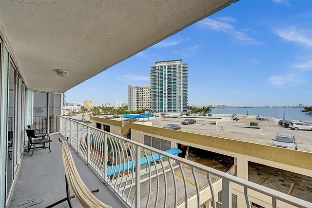 a kitchen with stainless steel appliances kitchen island granite countertop a refrigerator and a stove top oven