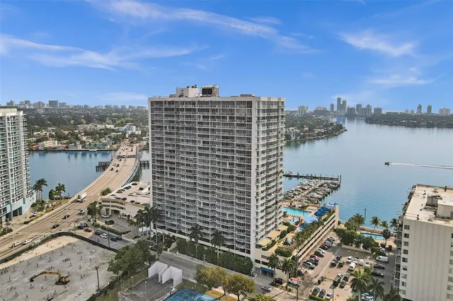 a view of roof with city view