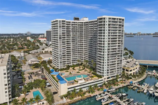a view of ocean with a multi story building