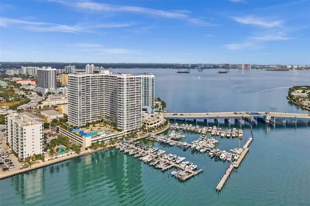 a view of a tall building next to a road