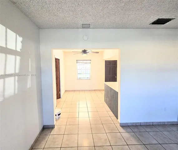 a kitchen with stainless steel appliances a refrigerator and a stove