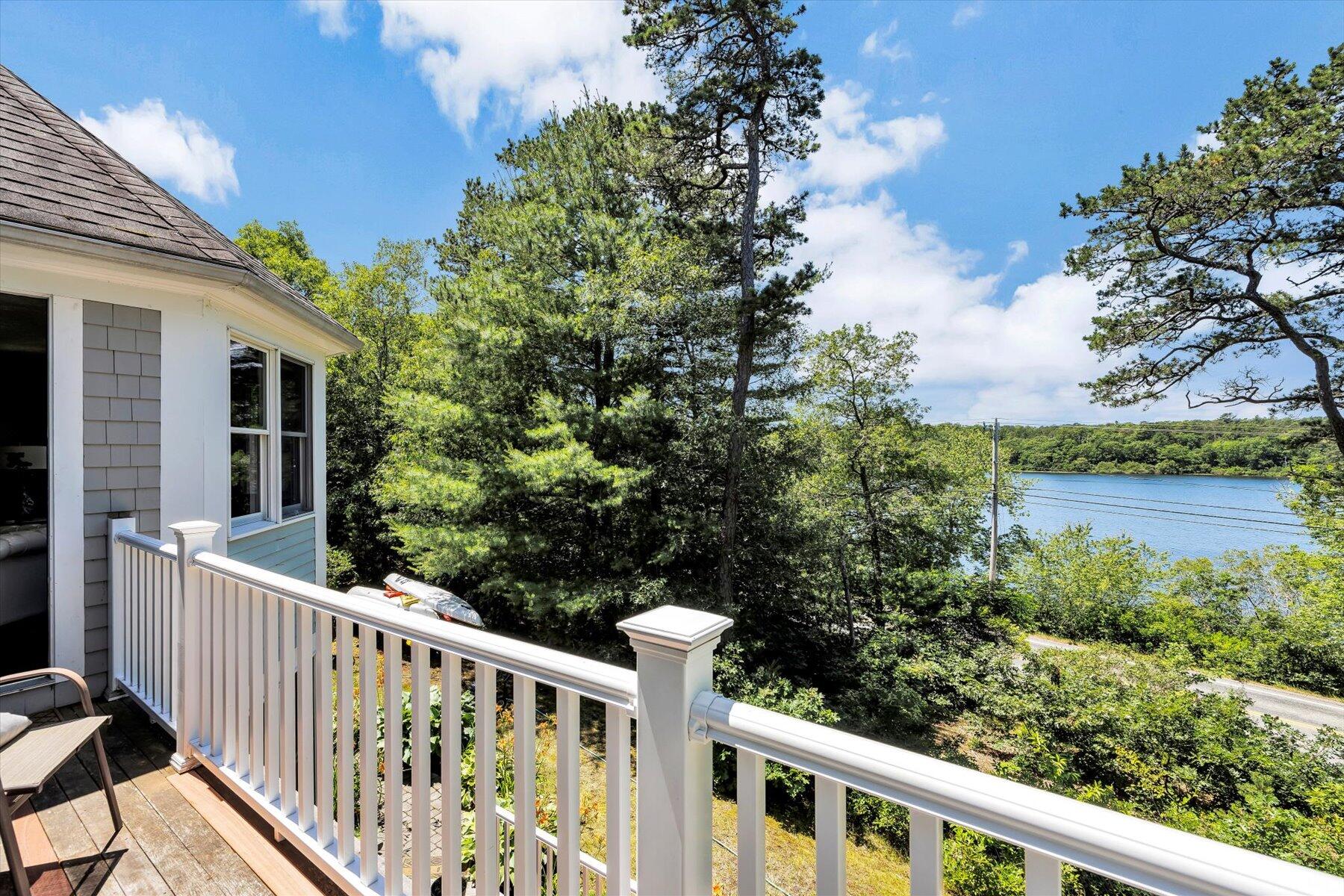 1 Ravens Nest Road Sandwich, MA 02563 - Photo 29 of 46 a view of a wooden deck and a lake view