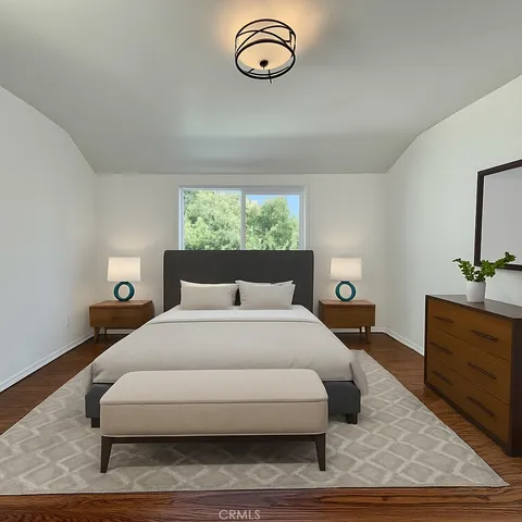 a bedroom with a bed and window