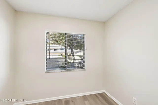 a view of an empty room with a window