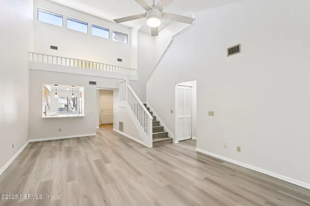 a view of an entryway with wooden floor